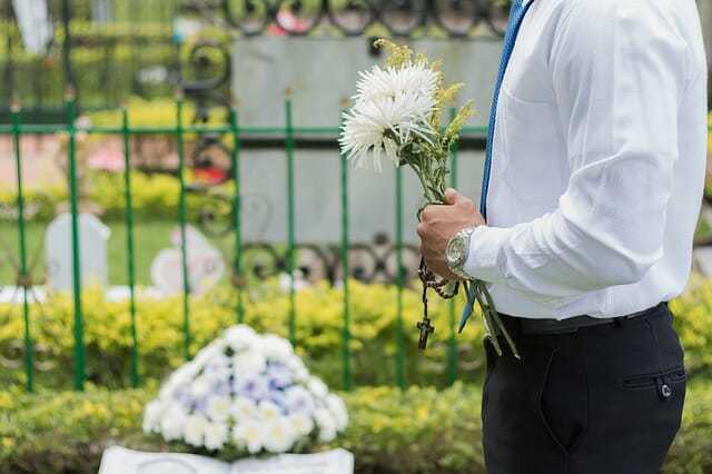 Flowers at a funeral for mom where the eulogy will be delivered